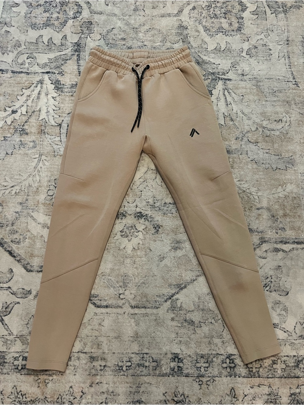 Alphalete Women's Track Joggers in Beige with Black Drawstring